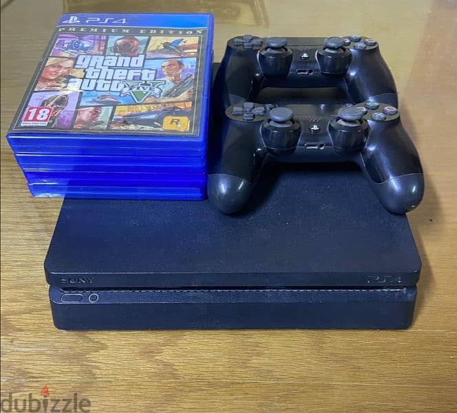 Playstation 4 slim 500 gb with 2 controllers and 4 CDs 0