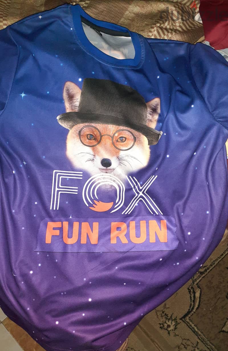 T-shirt blue with purpleand soft fabric and logo of fox 0