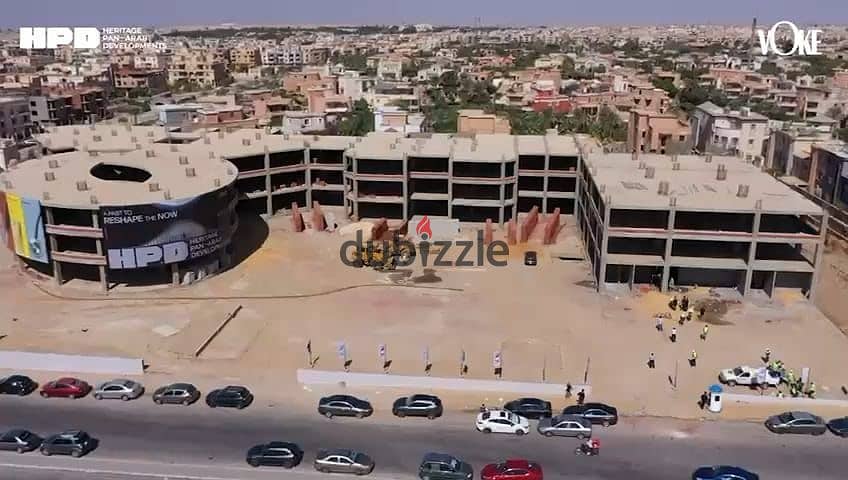 Shop for sale in installments, Prime Location, on Sadat Axis, next to Nermin Ismail School and the Police Academy, in front of Al Kazar Compound and n 0