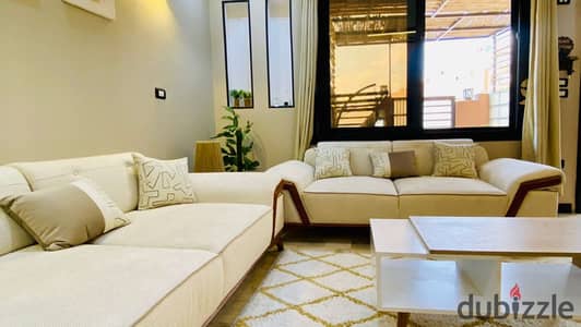 Ground floor apartment with garden for sale in the 16th District, Sheikh Zayed, finished with kitchen