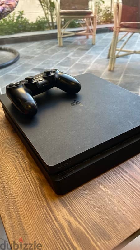 Playstation 4 Slim - 1TB , 2 Controllers (1 needs light  maintenance) 2