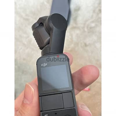 dji osmo pocket 2 + حامل معدني وترايبود قوي زيرو