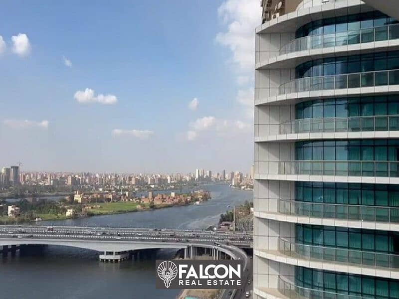 Receive now an apartment managed by Hilton Hotel, super deluxe finishing, with a direct view of the Nile Corniche, Nile Pearl Towers 0