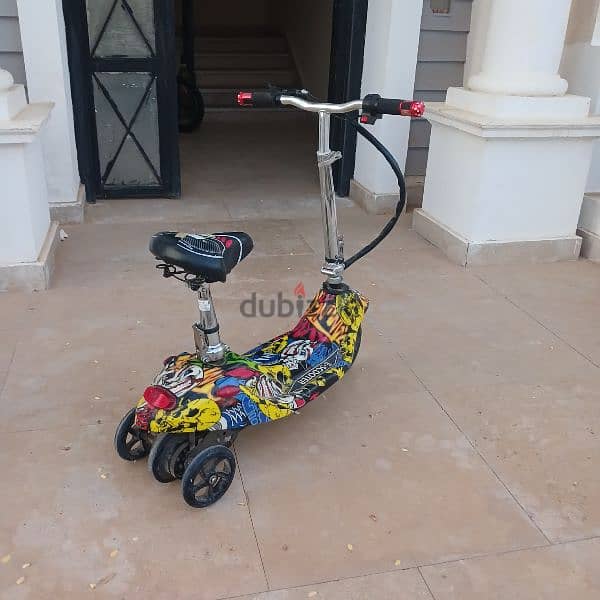 scooter graffiti 2 battaries سكوتر اطفال بكرسي 2