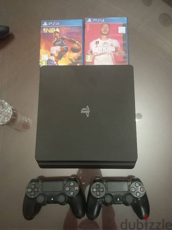 PlayStation 4 with 2 controllers 0