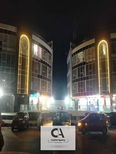 Solution for sale in Banafsaj Services, 2 villas, ground floor, semi-finished, the mall is operational, and the shops around it are already open. The