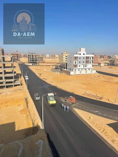 Land for sale in South Suez, double face, on a garden in Beit Al Watan, New Cairo, area of ​​460 square meters, pure price, with a license and permit