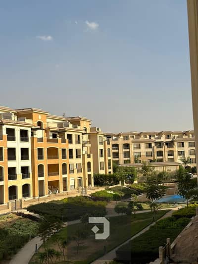 Apartment for sale with a garden view in Stone Residence Compound - New Cairo