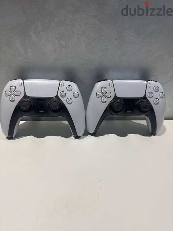 playstation 5 with two controllers 3