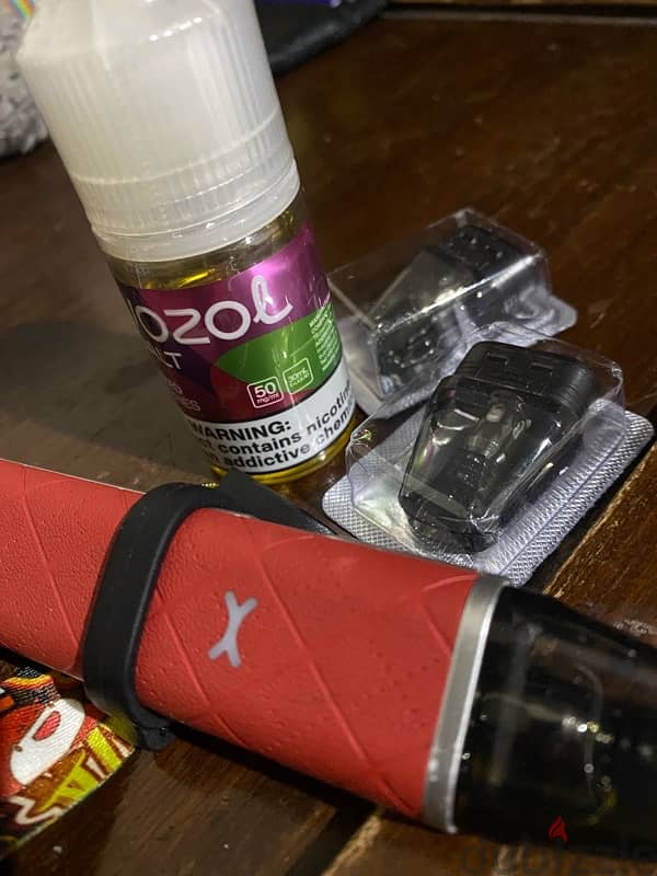 xlim go with 2 new cartridges and vozol liquid 0