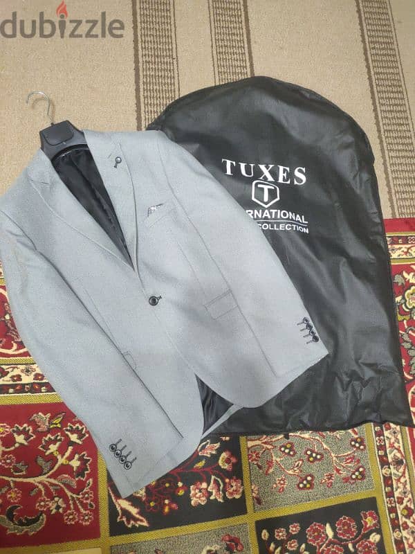 بليزر رمادي مقاس ٥٠ براند محترم Tuxes جديد بحالته لم يلبس ولا مرة حتي 2