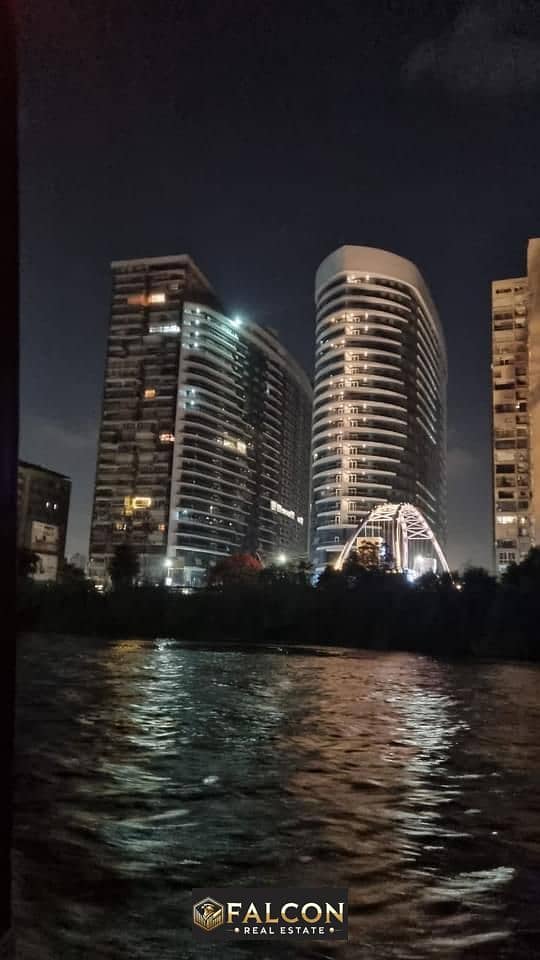 استلم فوري شقة فندقية بتشطيب كامل وإطلالة بانورامية على النيل مباشره في ابراج نايل بيرل Nile Pearl Towers بالتقسيط 0