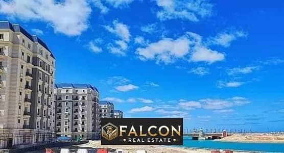 Own an apartment with a distinctive sea view of the Crystal Lagoon, immediate receipt, with Ultra Super Lux finishing, in the heart of New Alamein