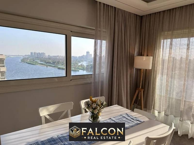 For sale, an apartment with ready to move , hotel finishing, with furniture and air conditioners, panoramic view of the Nile Corniche, next to the 0