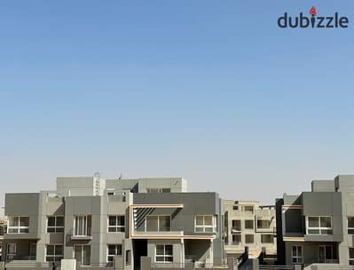 View and immediate delivery of an apartment in a prime location in the heart of Grand Heights, Sheikh Zayed, behind Mall of Arabia.