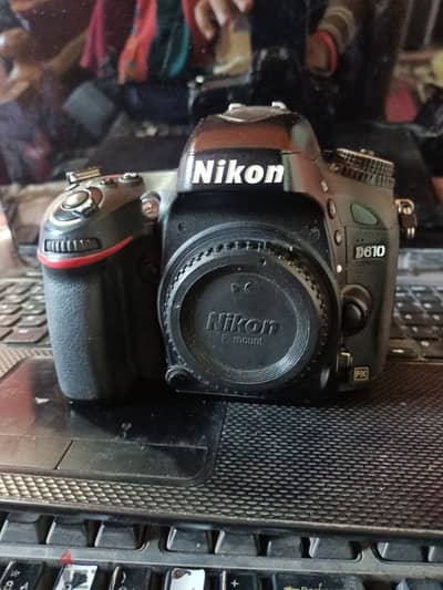 نيكون 610 جراب سيليكون وبيتري جريب وفلاش 980 nikon for canon