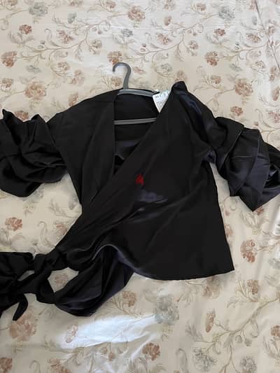 black satin cross over top with ruffle sleeves