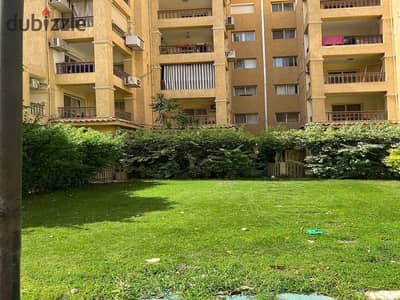 In Madinaty, apartment for sale, 100 sqm, ground floor, 45 sqm private garden, first residence, view garden, sea direction, in front of Open Air Mall