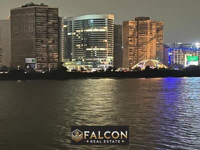 Luxurious hotel apartment directly on the Nile, immediate delivery, fully finished and with Hilton Maadi hotel services in the Nile Pearl Hotel Towers