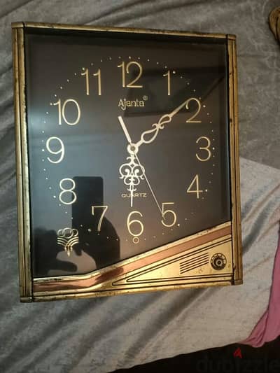 شحن  Ajanta clock ساعة للحيط تدق و بموسيقى تسليم باليد او شحن