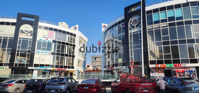 A shop for sale and investment in a commercial mall in First Settlement, Services of Al-Banafseg, behind Waterway, currently leased to a café.