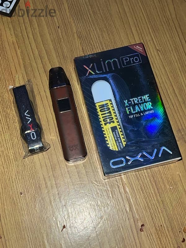 Oxva Xlim Pro - بود جلد بني بالعلبة وكل مشتملاته - Leather Edition 4