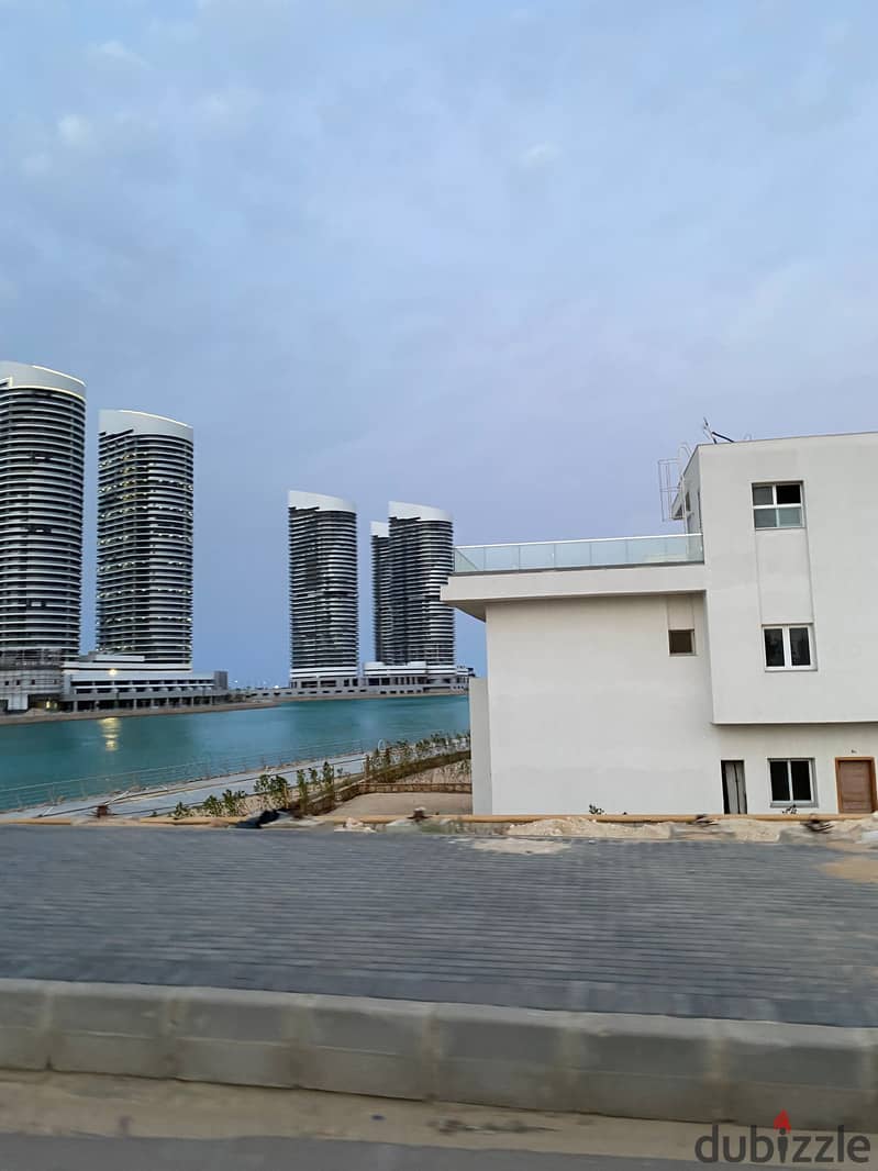 Investment opportunity for sale, the best corner townhouse, 340 m, in El Alamein City, in front of the towers closest to the lake and the yacht marina 0