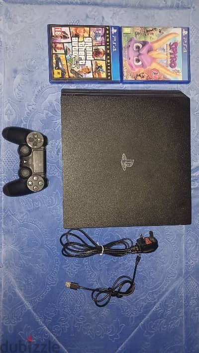 PS4 Pro 4K with 1 controller and 2 games,power cable and charger cable