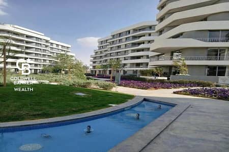 mostakbal city apartment for sale in bloom fields / fully finished in  tatweer misr  / BUA : 135 m / 2 bedrooms /1 master / prime location / open view