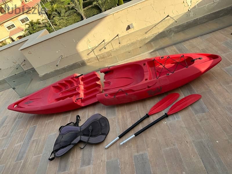 Red Kayak with paddle 1