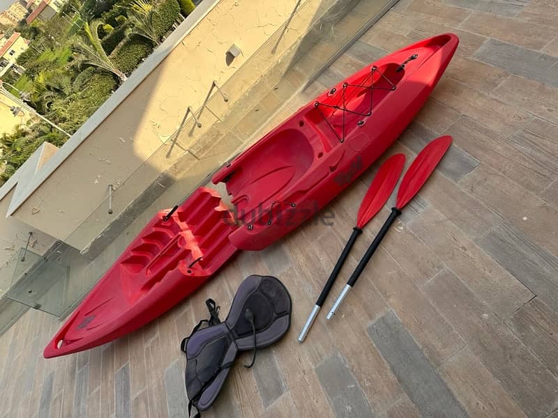 Red Kayak with paddle 3