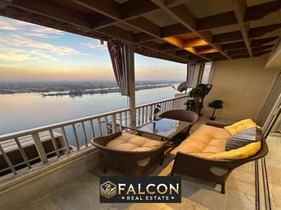 For sale, a fully furnished apartment in a hotel - immediate delivery - view of the Nile Corniche, next to the Hilton Hotel