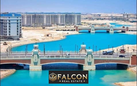 Receive the apartment, fully finished, ready to move in, double view, first row, directly on the sea and El Alamein Towers, at a special price, and av