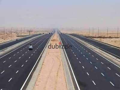 Land for sale in Sheikh Zayed, directly on Dahshur link, Zayed 5 entrance, lands for sale in October & Zayed, commercial land for sale in Sheikh Zayed