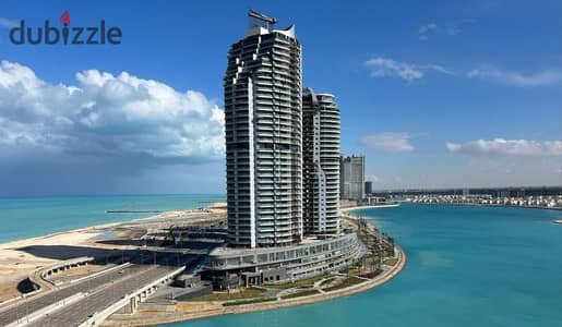 A ready-to-move-in apartment with an open view of the sea, fully finished with air conditioning, for sale in Al Alamein Towers