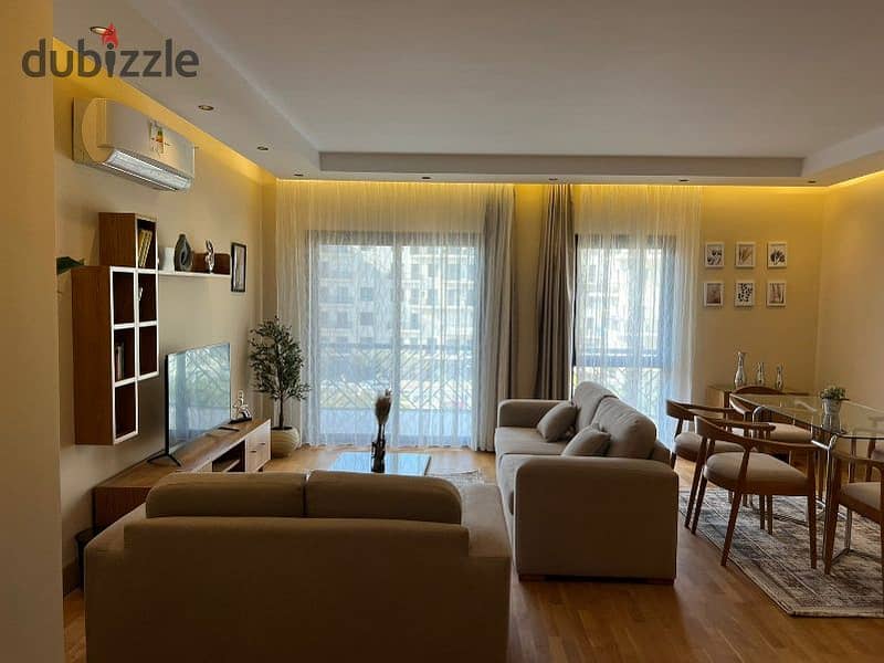 A fully furnished 2-bedroom apartment with modern furniture and contemporary finishes for rent in Eastown Compound, Fifth Settlement, New Cairo. 0