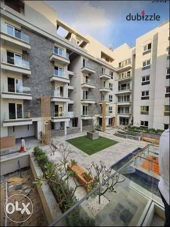 Own a 3-room apartment in a garden with excellent division  In the heart of the Fifth Settlement  minutes to the american university  Free cl