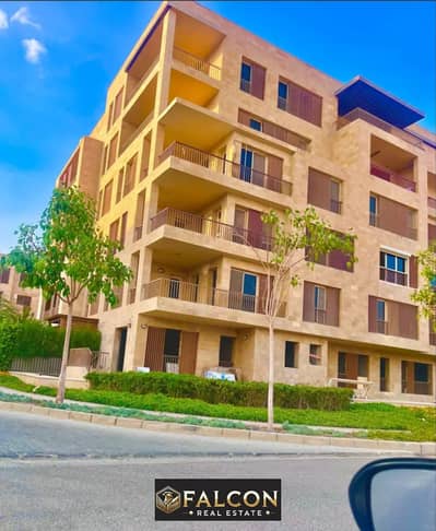 Ground floor apartment with garden for sale at half price in Taj City in front of Cairo International Airport in New Cairo