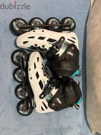 white skate cogar 509 and oxelo safety kit