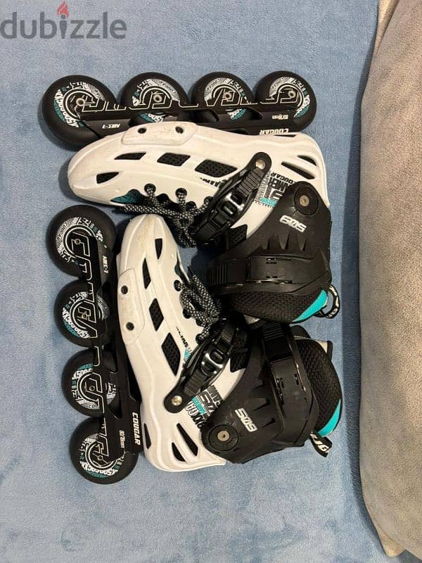 white skate cogar 509 and oxelo safety kit 0