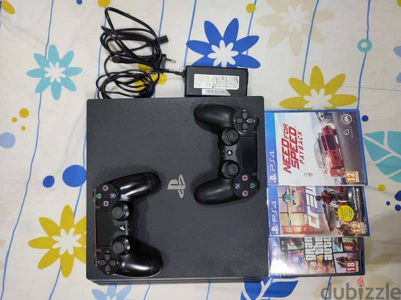 PS4 PRO 1TB 4K 60HZ WITH TWO ORIGINAL CONTROLLERS AND THREE CD GAMES 0