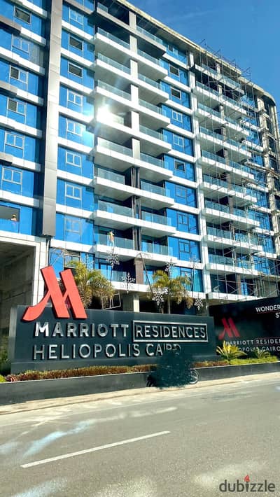 invest now in hotel apartment for sale mange by Marriott hotel with highest return rented in dollar in front of cairo airport