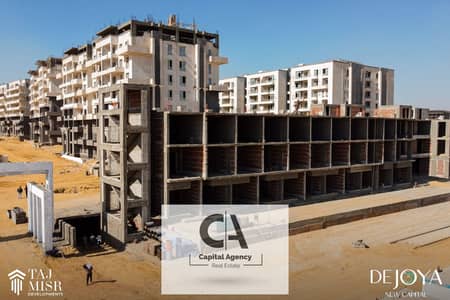 Own a 3-room apartment with a down payment of 390 K. with a private terrace in the New Capital next to the American University in Tag Misr _ De joya