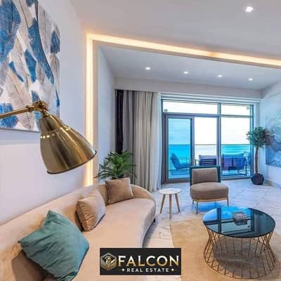 Receive and pay in installments at the lowest price, an apartment with a sea view, ultra super deluxe finishing, a direct view of the lagoon and the s