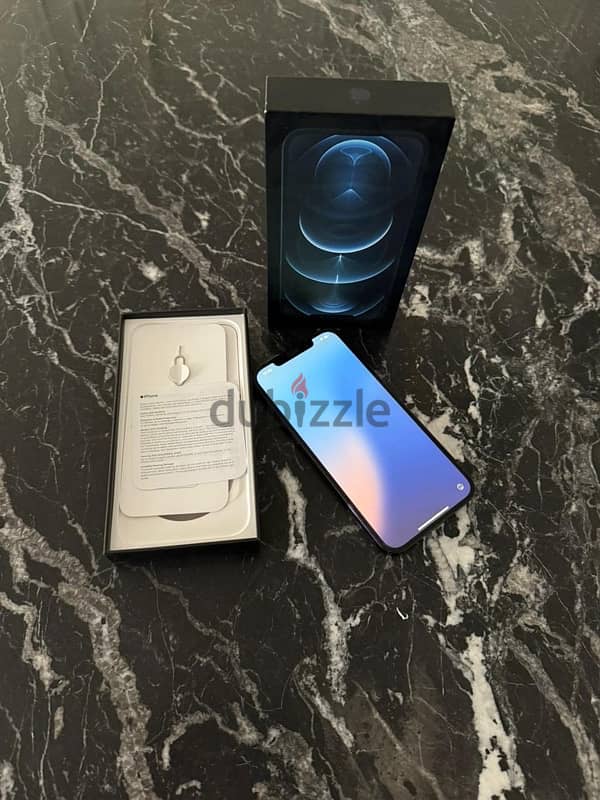 IPhone 12 pro max 128 titanium blue face id as new/ايفون ١٢ برو ماكس 1