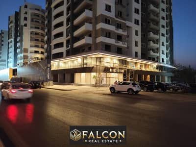 For sale, a shop directly on the facade, immediate delivery, in front of Cairo International Airport, in New Nozha, in the Rich Point project