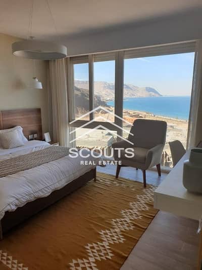 Chalet for sale in Monte Galala, Ain Sokhna, delivery soon, fully finished, directly on the sea, with the longest payment period, with air conditionin