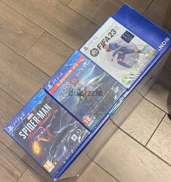 ps5 with extra charger , ps5 controller and 3 sealed games 1