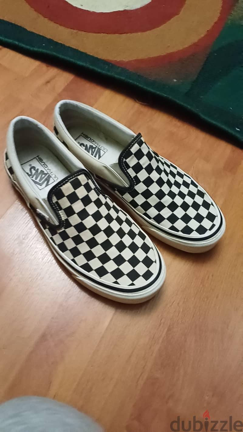 Vans black and white checkered shoes 6