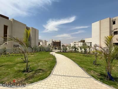 For sale on installment, a 492 sqm villa with a landscape view, located next to Giza Plateau, in The joulz compound.